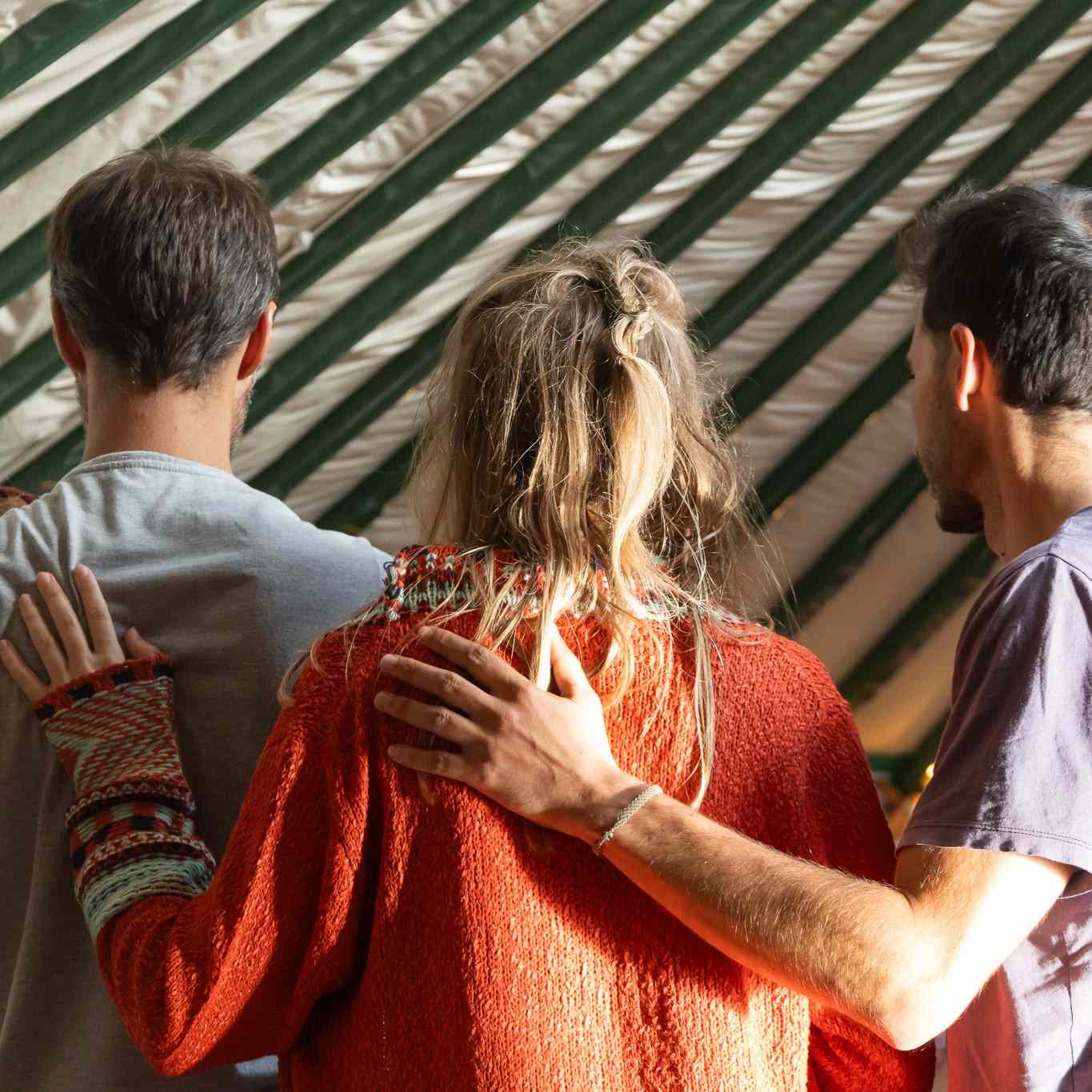 Participants standing together inside a yurt, image 7 of 13